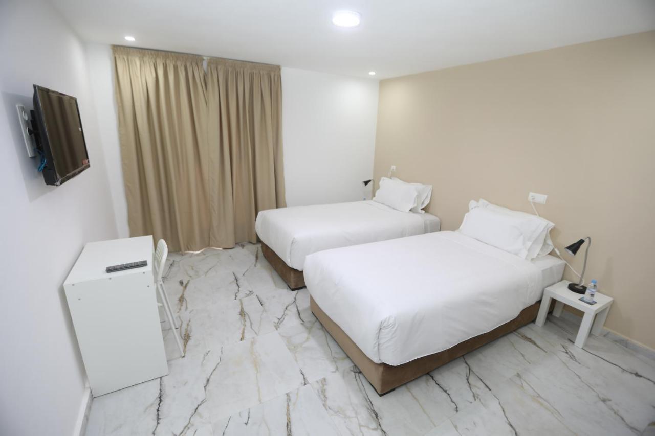 Mji Group Hotel Тан-Тан Екстериор снимка