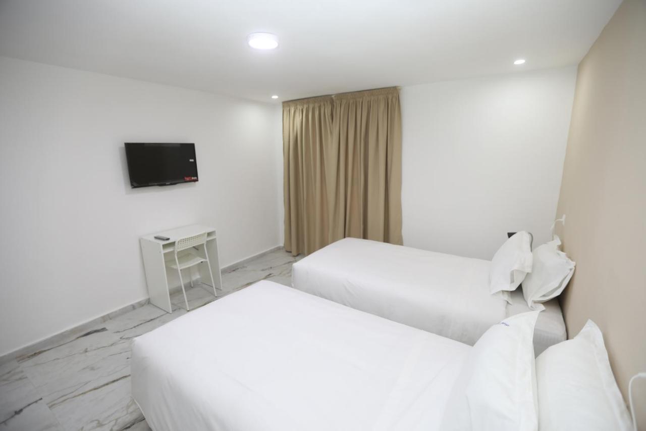 Mji Group Hotel Тан-Тан Екстериор снимка
