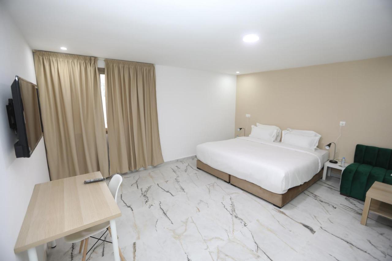 Mji Group Hotel Тан-Тан Екстериор снимка